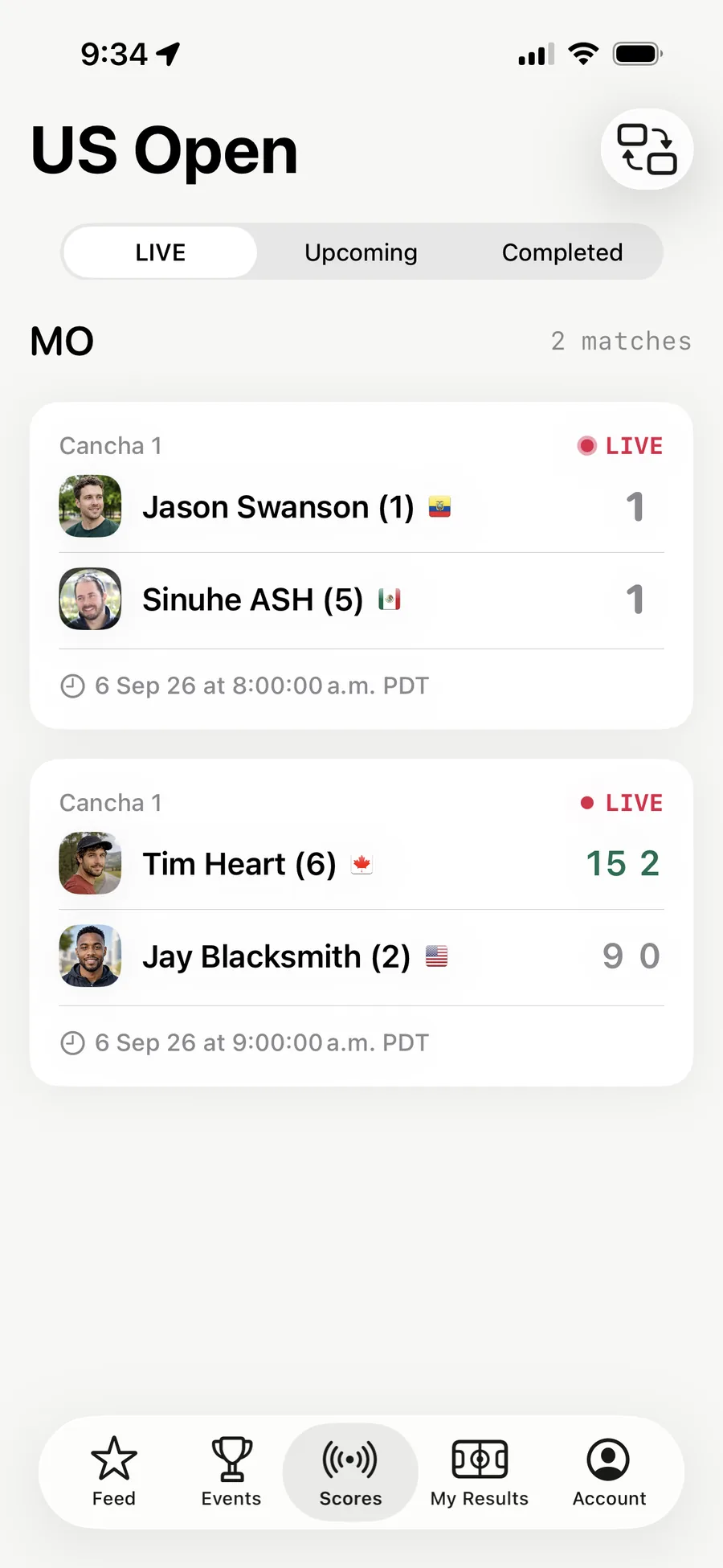 The Scores tab in the AirScoreboard app — two matches marked LIVE on court, each with both players, their flags and the running score.